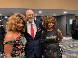 Guests posing for a photo at a MESHOF event