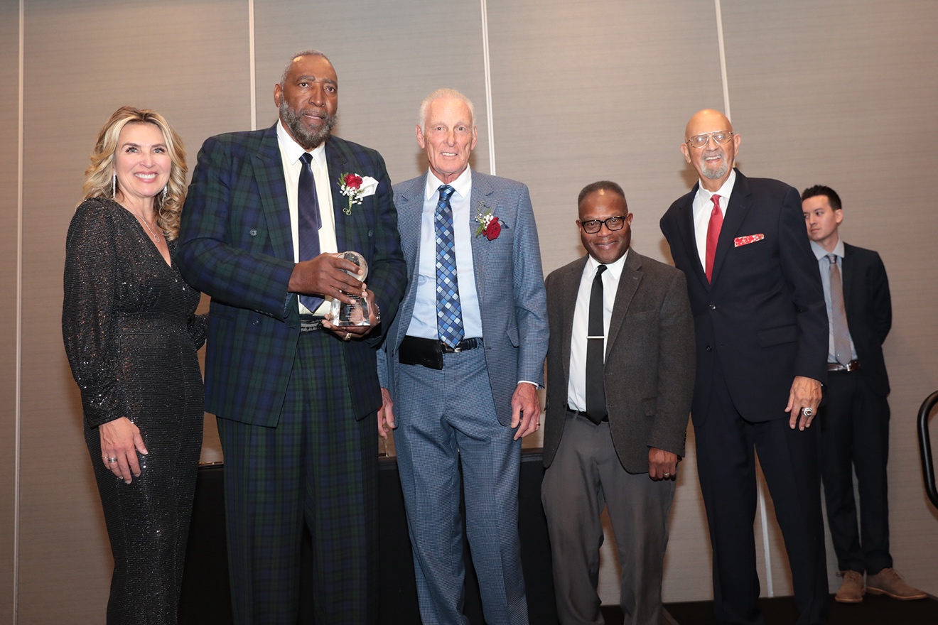 Honorees and presenters on stage at the induction ceremony