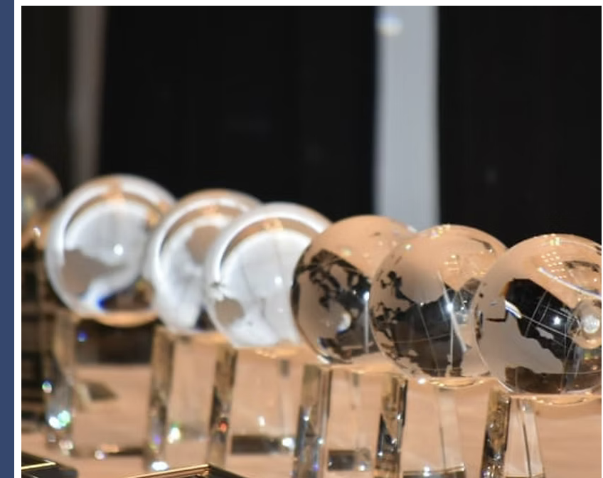 Crystal globe awards displayed at the Hall of Fame induction ceremony