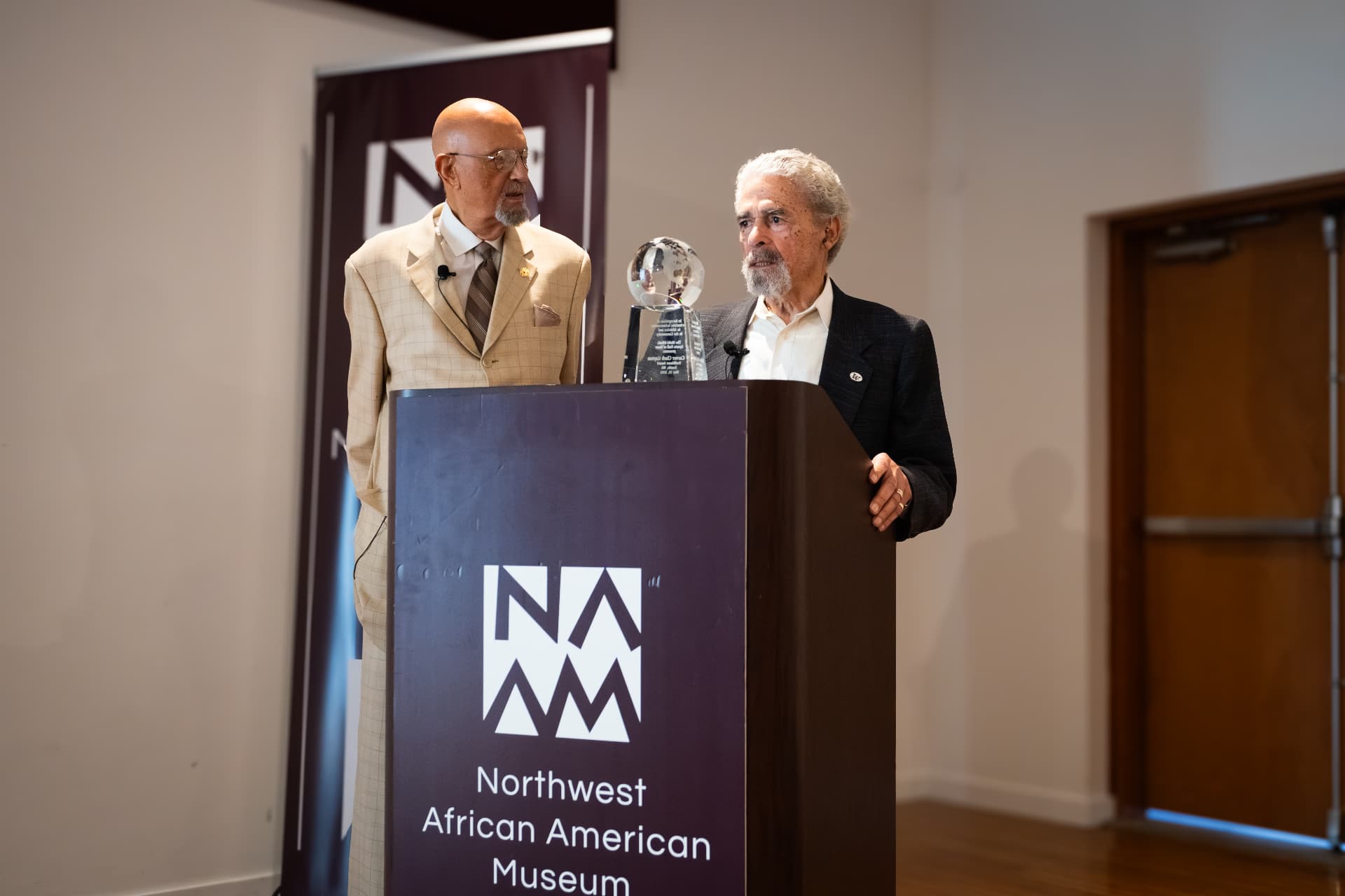 Carver Clark Gayton delivering remarks at a podium