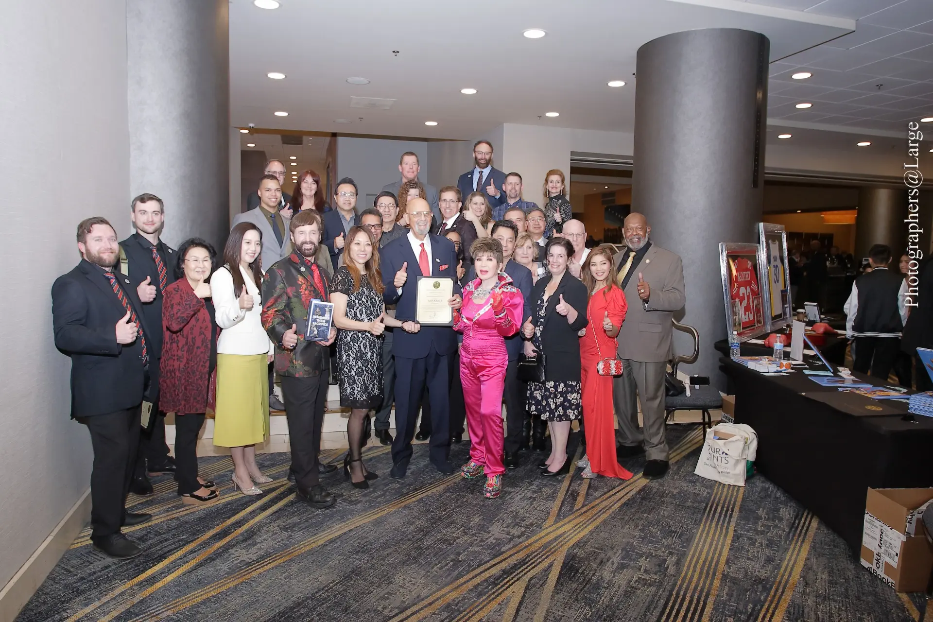 Large group giving thumbs up at a MESHOF celebration