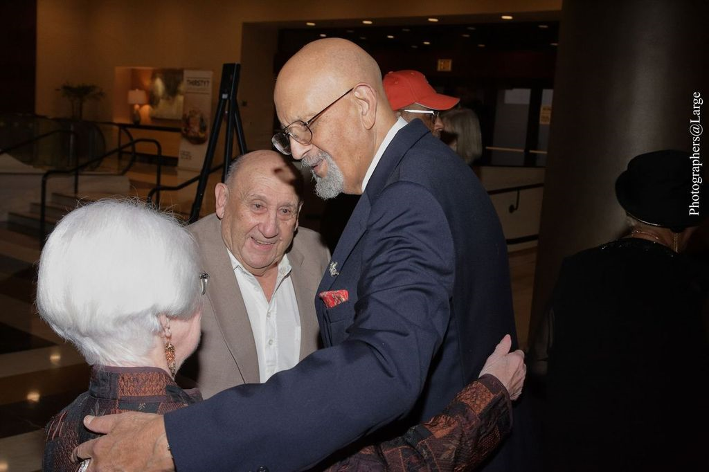 MESHOF founder greeting attendees at an event